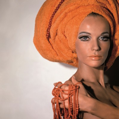 Veruschka wearing an orange towel on head